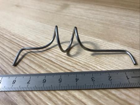 Cintrage de spirales  inox en diamètre 2 x 0,5 mm suivant une tolérance d'enveloppe de 0,3 mm  pour une application satellite